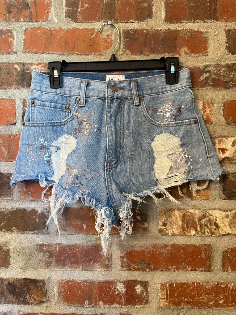 P126 - Twelve by Twelve Distressed Denim Shorts with Sequin Star Detail